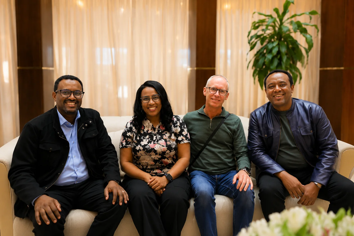 Four of the people behind Mother to Mother sitting together on a sofa.
